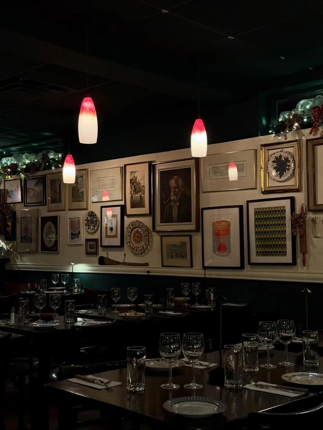 A row of set tables in the dining room, ready for a group dinner